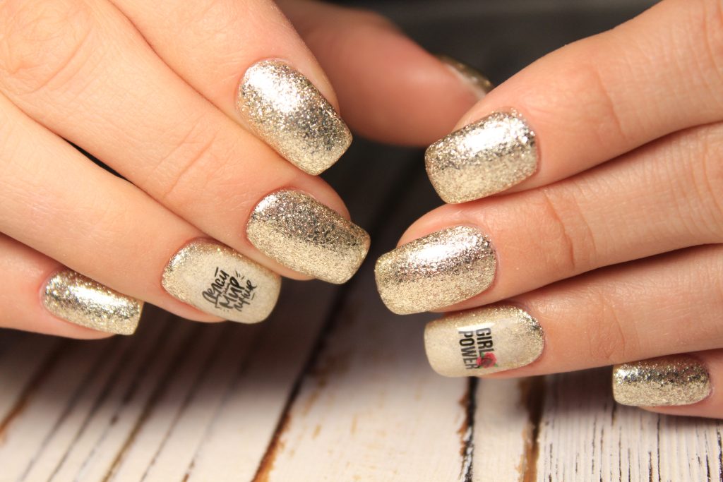 Sexual nail design on female hand close up.
